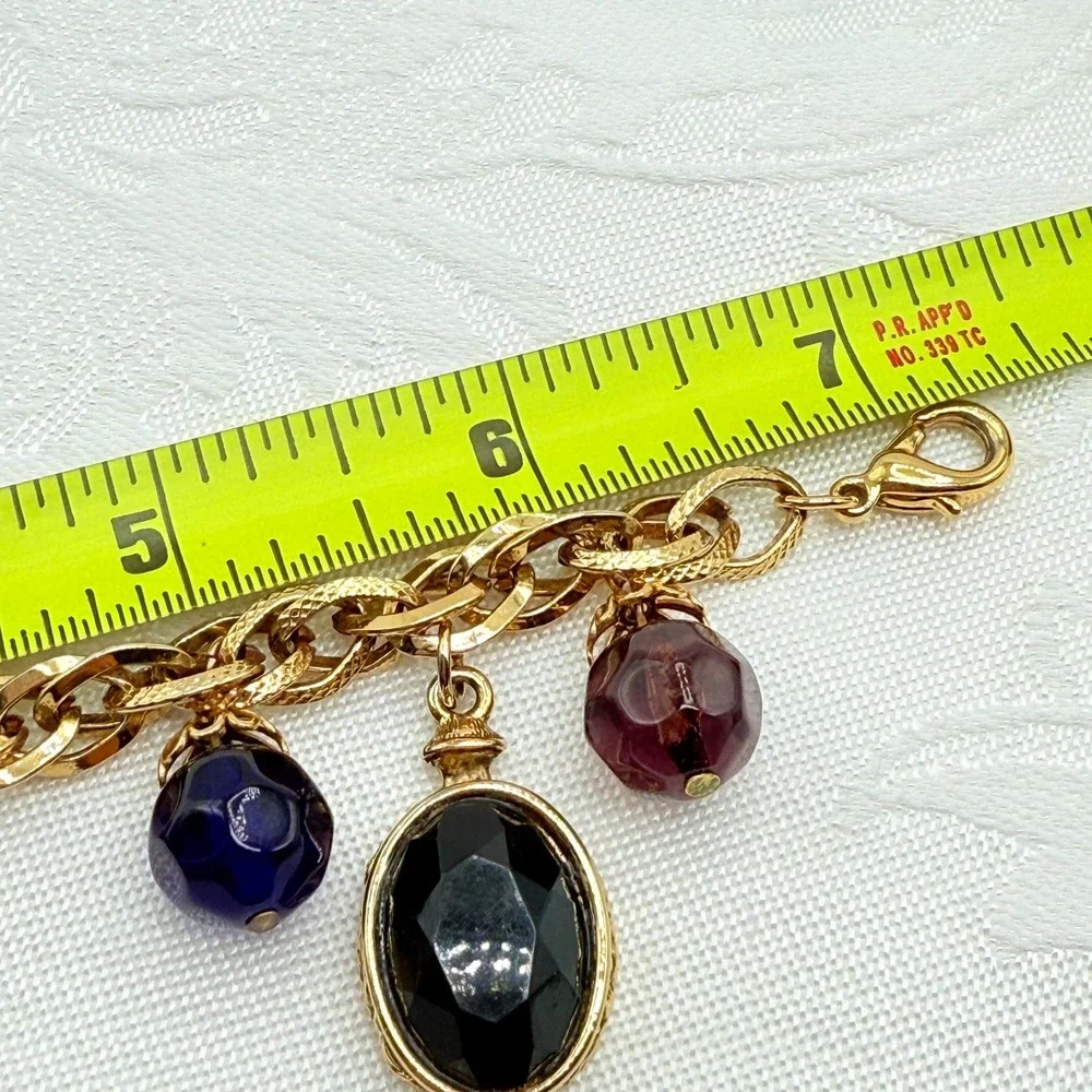 Vintage Gold Tone Charm Bracelet w/ Fleur de Lis, Ring, and Faceted Glass Beads